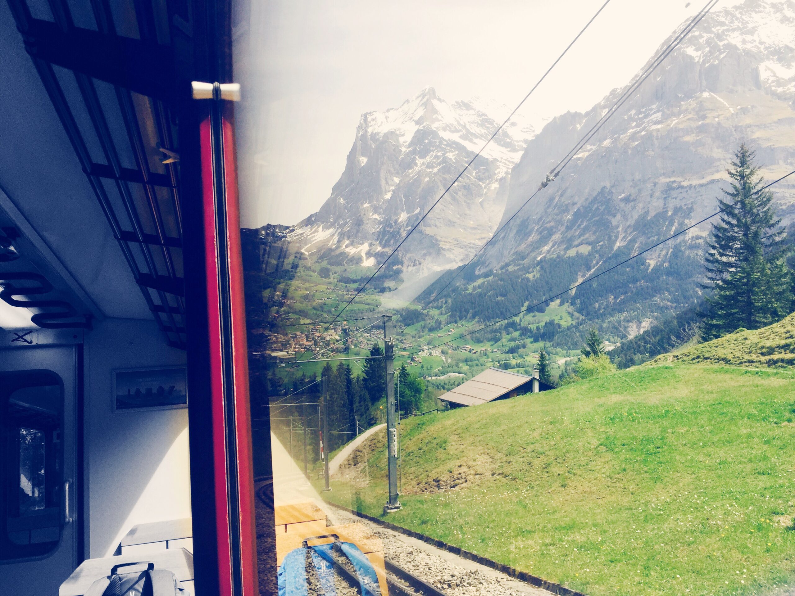 swiss-alps-seen-from-train-window-glass